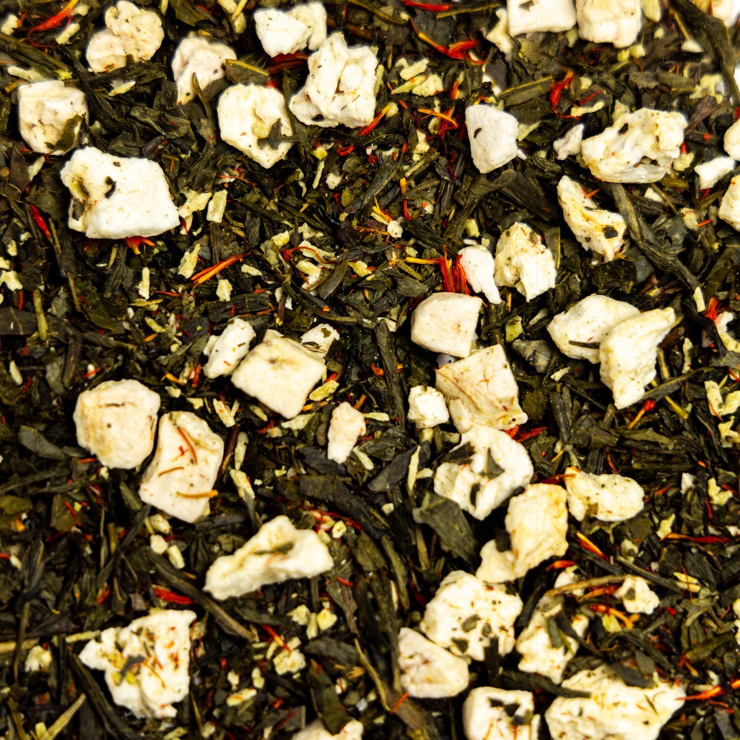 tropical loose leaf green tea. close up. banana, pineapple, coconut, safflower