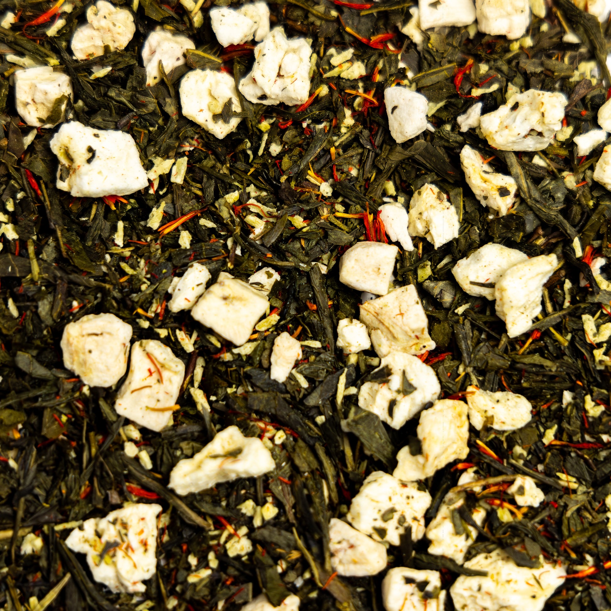 tropical loose leaf green tea. close up. banana, pineapple, coconut, safflower